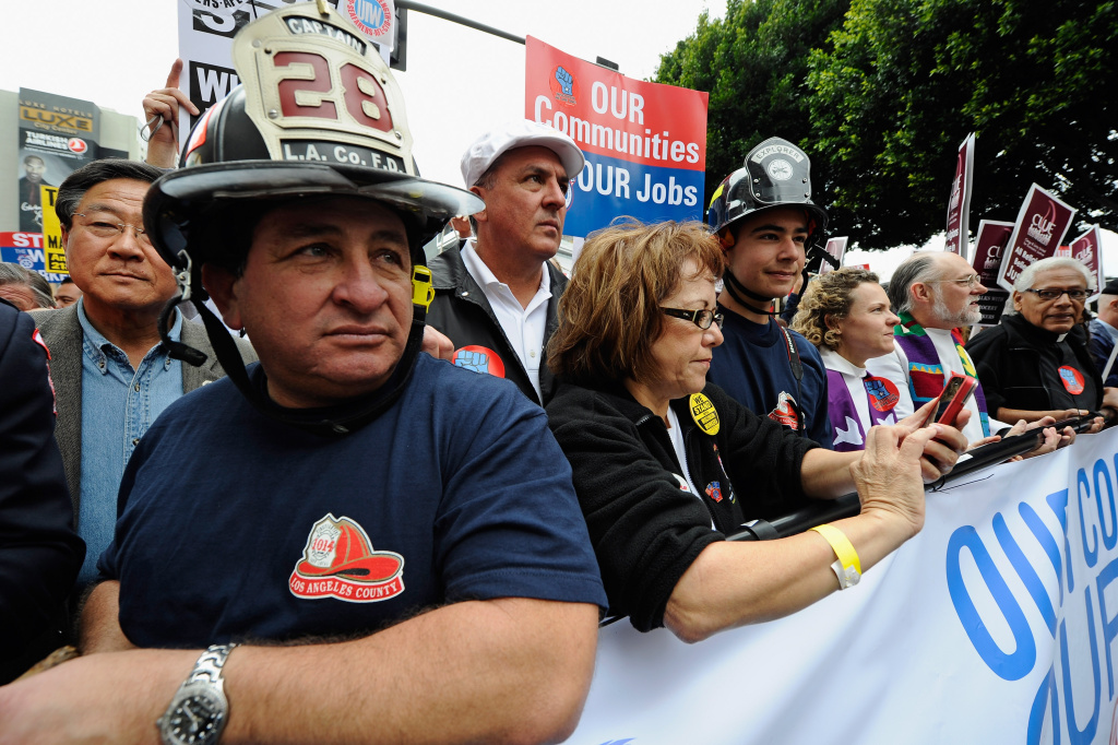 Labor Activists Hold Rally David Lopez, (L) a Los Angeles County Firefighter, Maria Elena Durazo, (C) from Los Angeles County Federation of Labor, AFL-CIO, participate in a march supporting union workers in what protesters have dubbed,