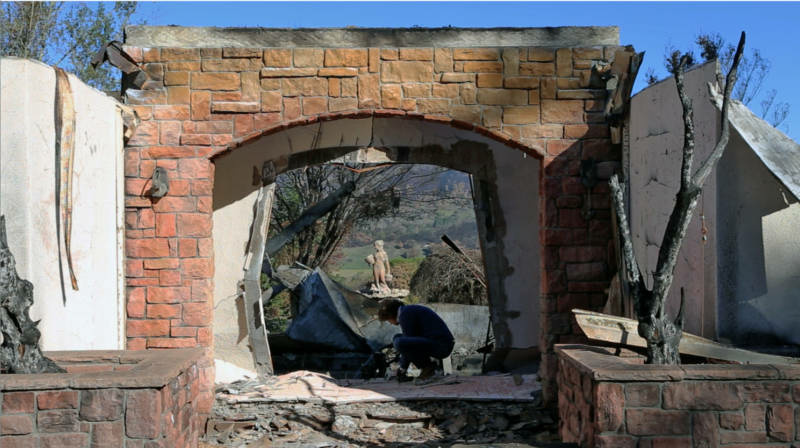 meek-800x448.jpg Jason Meek sifts through the remains of his home in Sonoma County.