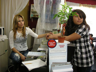 Wendy Arias, 29, left sits with her copy of the Census at Sharon Beauty Salon, one of 150 Questionnaire Assistance Centers sprouting up around Los Angeles.