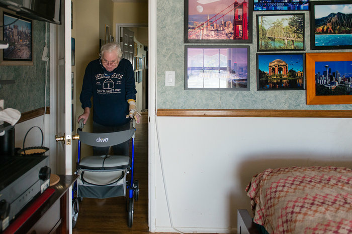 home-health Campbell is able to move around his house with the help of a walker.