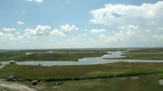 A Love-Hate History: Oil And Fishing In The Gulf -- Channels and bayous crisscross the marsh grasses in Cocodrie, La. Over the years, the cutting of channels for oil and gas exploration has contributed to Louisiana's receding coastline.