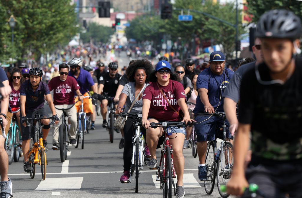 Car Free LA Cyclists ride open streets in downtown Los Angeles on Sunday, Oct. 18, 2015. Six miles of streets in and around downtown Los Angeles were closed to motor vehicles as the city's fifth anniversary celebration of the CicLAvia festival opened the lanes to cyclists, skaters and pedestrians.