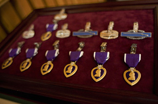 Mercer 10225 Purple Heart medals are seen before a presentation ceremony at the Walter Reed Army Medical Center in Washington, DC. The Purple Heart is awarded to those killed or wounded in action while serving with the U.S. military.