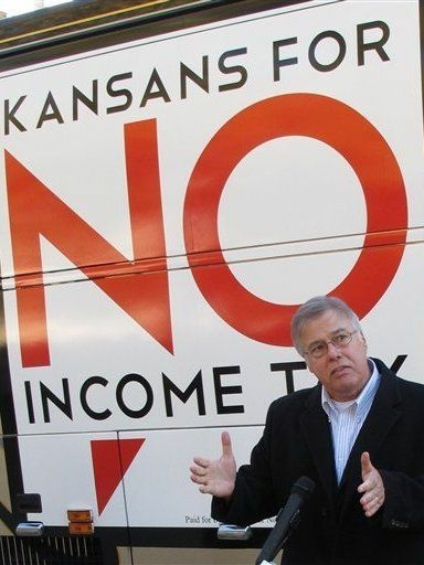 n Kansas, legislators are considering devoting extra funds to tax relief instead of hiring more state workers. Republican state Rep. Joe Patton of Topeka, shown in November, talks about proposals to eliminate the state's income tax.