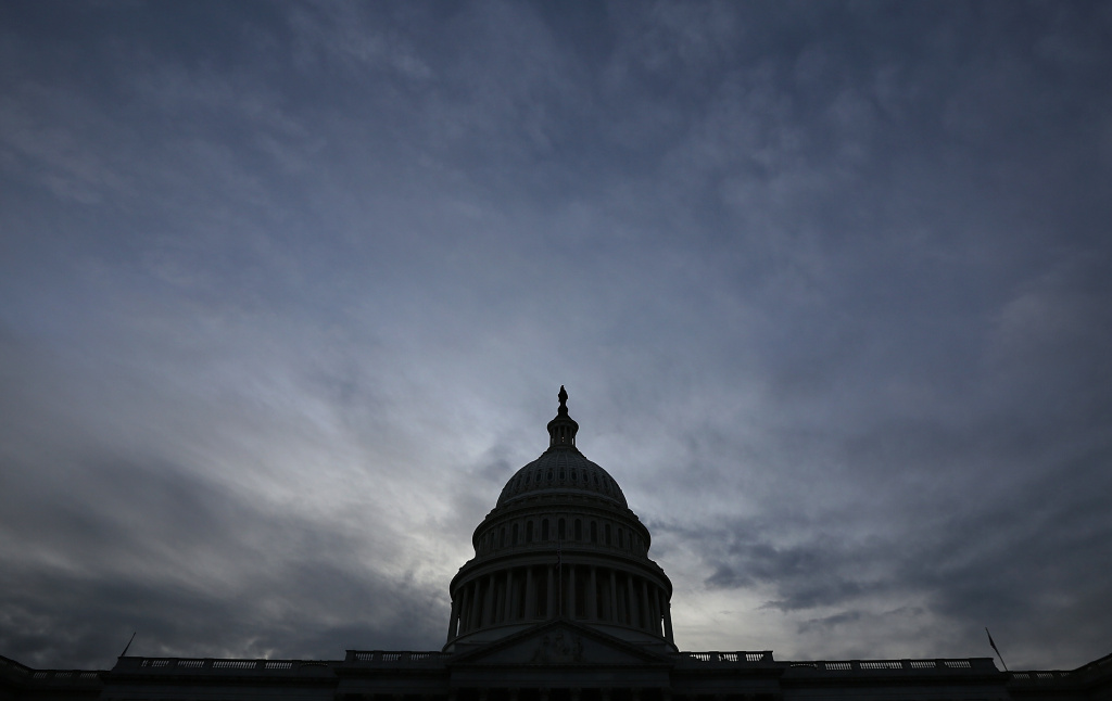 Government Shutdown Enters 2nd Week The U.S. Capitol is shown at sunset October 15, 2013 in Washington, DC. The U.S. government shutdown is in its fifteenth day as the U.S. Senate and House of Representatives remain gridlocked on funding the federal government and raising the nation's debt limit.