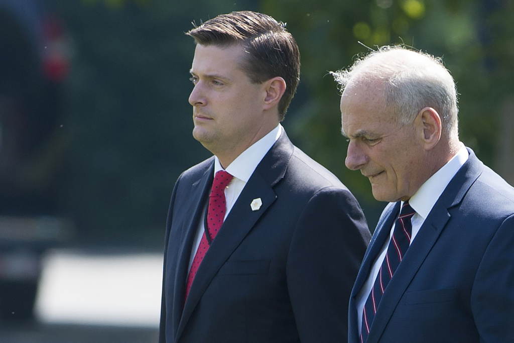 US-POLITICS-PORTER-KELLY White House Staff Secretary Rob Porter (left) and Chief of Staff John Kelly (right) walk to Marine One at the White House on August 4, 2017.