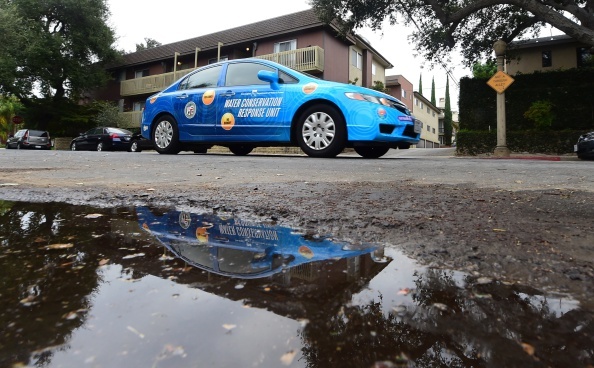 A 'water policeman' with the Water Conservation Response Unit in Los Angeles, patrols a neighborhood in Studio City, California on August 19, 2014 looking for homes or businesses wasting water during California's drought.