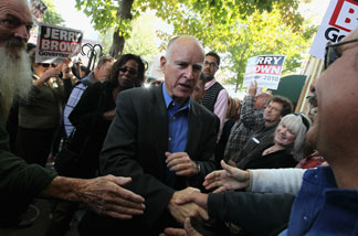 California attorney general and democratic gubernatorial candidate Jerry Brown greets supporters during a campaign rally at Broadway Heights restaurant October 31, 2010 in Chico, California.