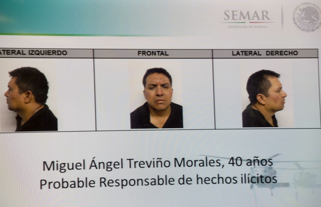 MEXICO-CRIME-DRUG-ZETAS Picture taken from a sreen of the alleged maximun leader of drugs Mexican cartel 'Los Zetas', Miguel Angel Trevino Morales, presented in combo pictures during a press conference at the head quarter of Interior Ministry on July 15, 2013 in Mexico City. According to a spokesman Trevino was arrested early morning during a military operation en Nuevo Laredo.