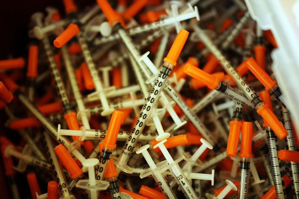 Used syringes are discarded at a needle exchange clinic. Used syringes are discarded at a needle exchange clinic.