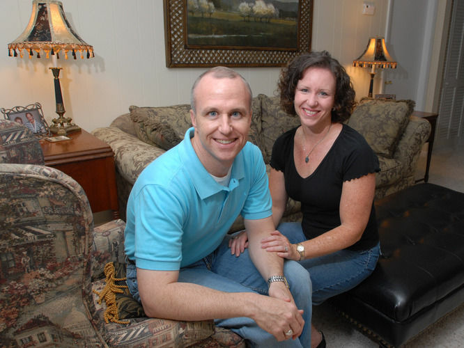 Alan Chambers, president of Exodus International, sits with his wife, Leslie, in their home in Winter Park, Fla., in 2006. Chambers recently announced his group will no longer associate with or promote therapy that focuses on changing sexual attraction.