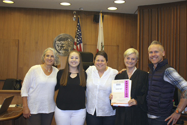 Tri Parenting In this October 2016 photo provided by Lin Repola, Victoria Bianchi, left, commemorates the adoption that made her officially the third parent of daughter Madison Bonner-Bianchi, second from left, at Marin County Superior Court, San Rafael, California. With them are, from left, Kim Bonner, Marin County Superior Court Judge Verna A. Adams, and Mark Shumway. Bianchi, Bonner and Shumway have all been part of their daughter’s life since her birth in 2000, but the adoption came only after a 2013 California law declared that a child can have more than two parents.