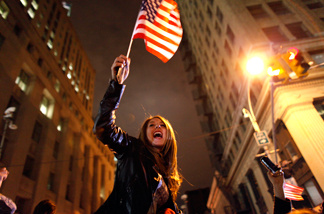 A large, jubilant crowd reacts to the news of Osama Bin Laden's death at the corner of Church and Vesey Streets, adjacent to ground zero, during the early morning hours of Tuesday, May 2, 2011 in New York.