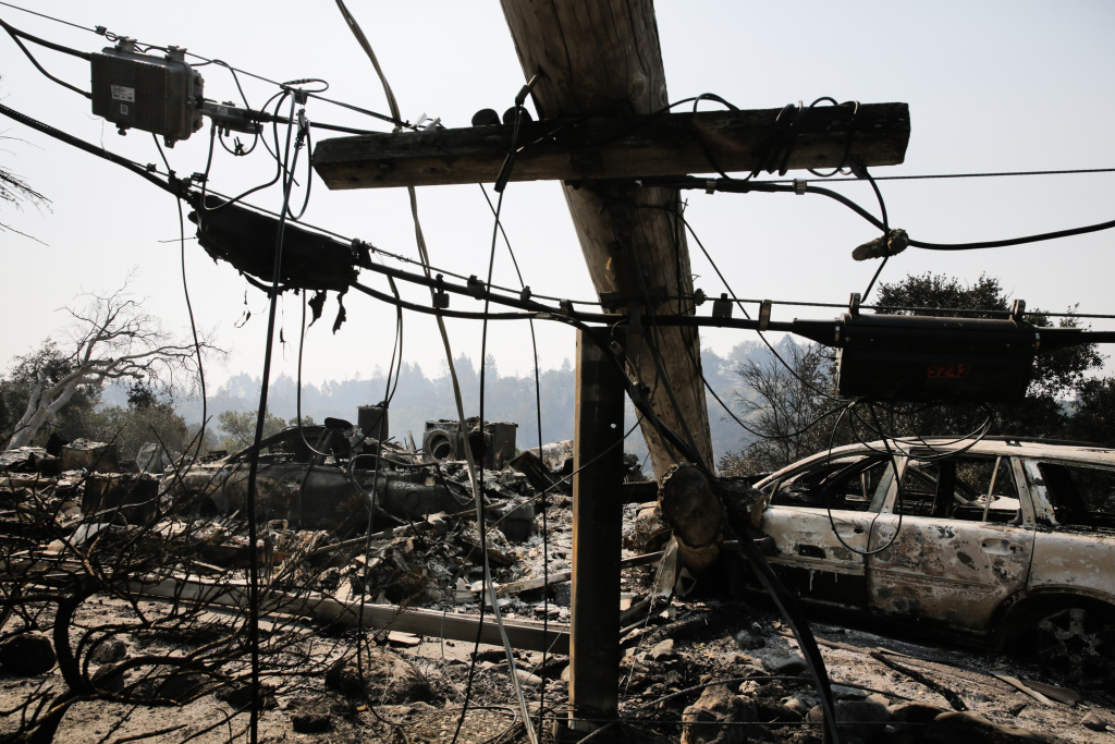 Multiple Wildfires Continue To Ravage California Wine Country A downed power line and the remains of a home and a car are seen in the Larkfield-Wikiup neighborhood following the damage caused by the Tubbs Fire on October 13, 2017 in Santa Rosa, California.
