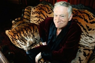 Mercer 12059 Hugh Hefner, CEO of Playboy Enterprises, poses for a photo during an interview with journalists at his mansion in Los Angeles.