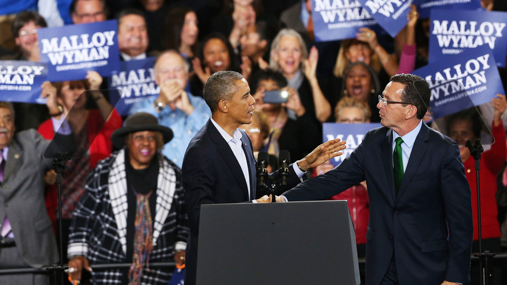 President Barack Obama stands with Connecticut Governor Dan Malloy in Bridgeport on Sunday. Malloy is in a tough re-election battle with Republican Tom Foley. The president spent the weekend trying to energize the Democratic base to get out and vote in Tu President Barack Obama stands with Connecticut Governor Dan Malloy in Bridgeport on Sunday. Malloy is in a tough re-election battle with Republican Tom Foley. The president spent the weekend trying to energize the Democratic base to get out and vote in Tuesday's middterm elections.