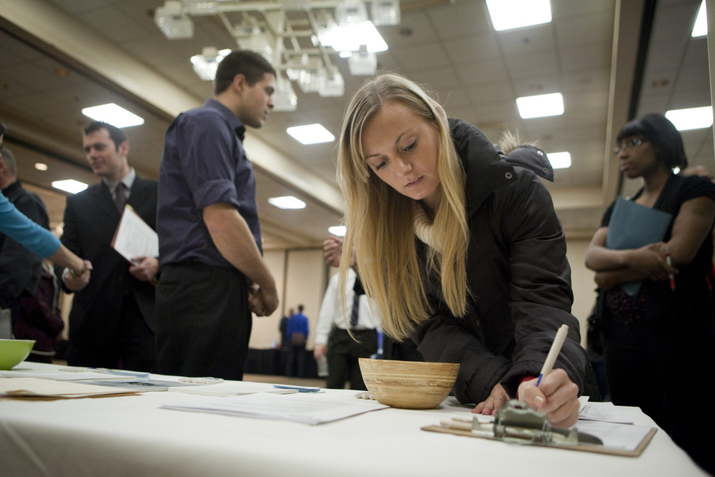 National Unemployment Rate Drops To 8.6 Intern Jenny Pazar fills out a form as she looks for a job at a job fair Dec. 2, 2011 in Portland.