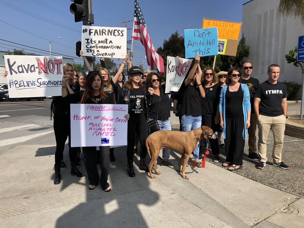 Protesters chant at passing cars while some drivers respond with a honk in solidarity. Protesters chant at passing cars while some drivers respond with a honk in solidarity.