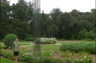 Mercer 7699 Huntington curator Jessica Smith, next to the 19-foot tall bronze