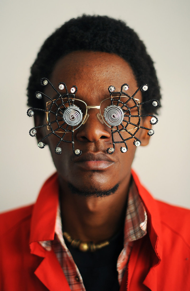 cyrus-karibu---copia-50_custom-bb54b69e1861be0898780b1ae0c3200aba8f1216-s800-c85.jpg Kenyan artist Cyrus Kabiru poses with an artwork resembling sunglasses on February 1, 2012 in Nairobi. Kabiru has created a range of artworks called