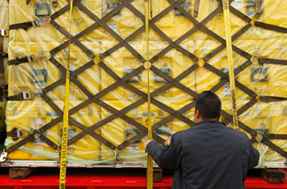 Los Angeles County Fire Department urban search and rescue team members load US Agency for International Development supplies to be flown to Haiti in the aftermath of the magnitude-7 earthquake onto truck on Jan. 13, 2010 in Pacoima, California.