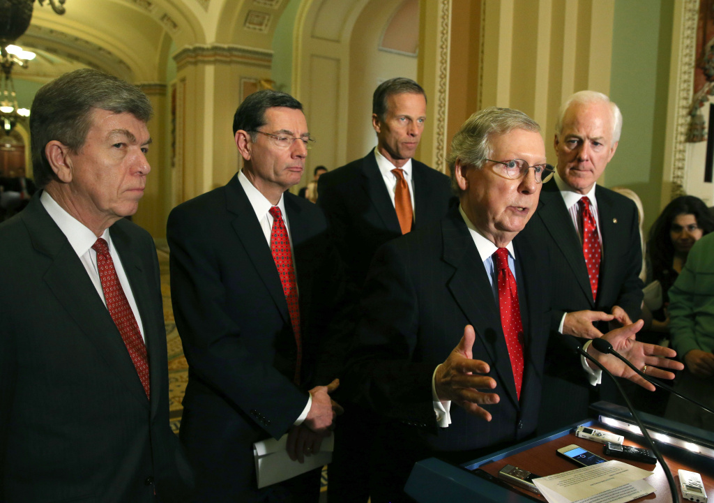 Senate Republicans Address The Media After Their Weekly Policy Meeting Senate Minority Leader Mitch McConnell (R-KY) (2nd-R) speaks to reporters while flanked by (L-R), Sen. Roy Blunt (R-MO), Sen. John Barrasso (R-WY) Sen. John Thune (R-SD) and Sen. John Cornyn (R-TX) after attending the weekly Republican policy luncheon at the U.S. Capitol on February 4, 2014 in Washington, DC. Senate Republicans gathered at a luncheon to discuss various issues including todays Farm bill vote.