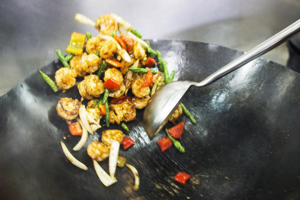 Panda Express - Inline - 3 Jimmy Wang, director of culinary innovation, prepares five-flavor shrimp, a newly developed dish, at the Panda Express Innovation Kitchen in Pasadena on Thursday morning, May 11, 2017.