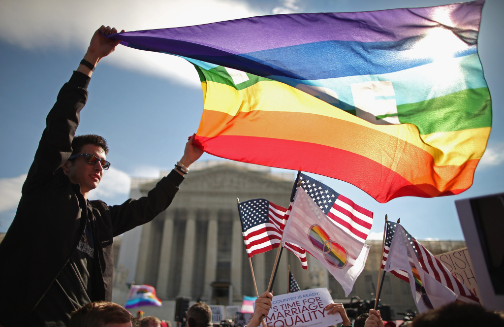 Supreme Court Hears Arguments On California's Prop 8 And Defense Of Marriage Act Eric Breese (L) of Rochester, New York, joins fellow George Washington University students and hundreds of others to rally outside the Supreme Court during oral arguments in a case challenging the Defense of Marriage Act (DOMA) March 27, 2013 in Washington, DC. The Supreme Court will hear arguments in the second case this week about same-sex marriage.