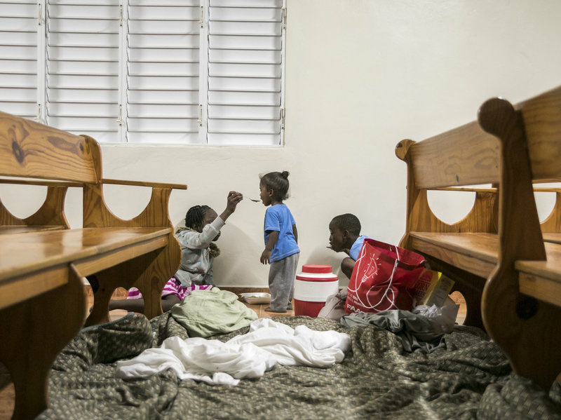 ap_17250134286382-5fa041d9c7c51dcca68780f5ddb8d35ea556e267-s800-c85.jpg Kids have dinner at a shelter in a local church during the evening before the arrival of Hurricane Irma in Las Terrenas, Dominican Republic, on Wednesday.
