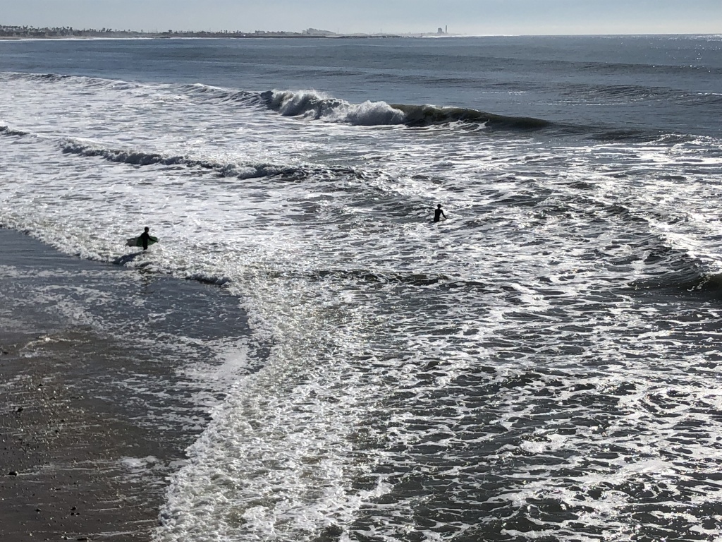 high surf advisory Two brave surfers venture into the high-surf advisory.