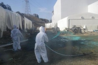 Mercer 16908 Workers at the Fukushima Dai-ichi nuclear power plant. The cleanup operation at the facility could take more than a decade. Plant officials Tuesday said power has been restored to two fuel storage pools at Japan's tsunami-damaged nuclear plant, but two others have been without fresh cooling water for more than a day, raising concerns about the fragility of a facility that still runs on makeshift equipment.
Tokyo Electric Power Co. said that pool temperatures at the Fukushima Dai-ichi plant were well within safe levels, and that pools would remain safe for at least four days without fresh cooling water.