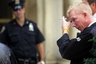 Mercer 20099 A trader stands outside of the New York Stock Exchange during afternoon trading on August 8, 2011 in New York City. The Dow finished down more than 600 points Monday after Standard and Poor's downgraded the U.S. credit rating.