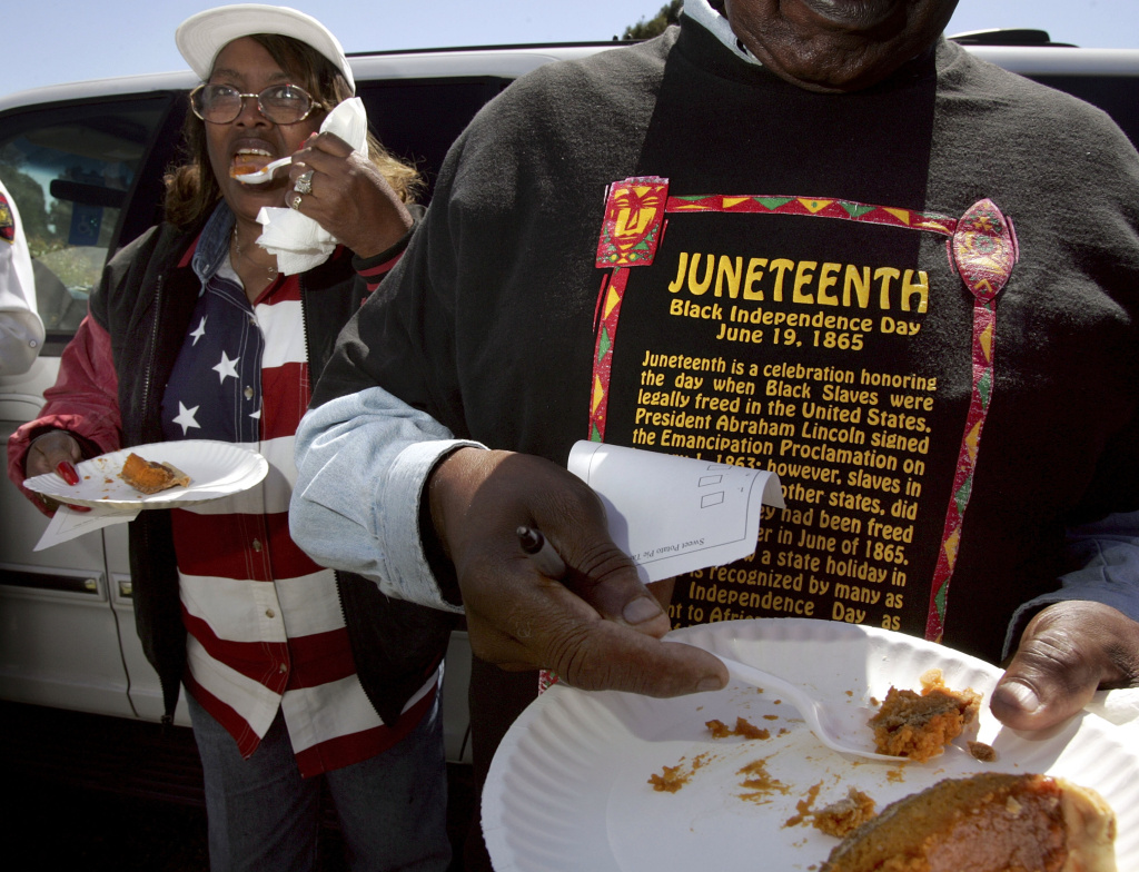 Juneteenth Naomi Williams (left) and D'Emanuel Grosse Sr. (right) taste the sweet potato pie entered in the cook-off contest at the Juneteenth, Black Independence Day celebrations on June 19, 2004 in Richmond, California. The holiday is celebrated in June because slaves in Texas and several other states did not learn of their freedom until June of 1865.