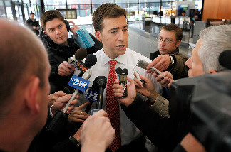 U.S. Senate candidate Alexi Giannoulias fields questions from reporters after being corralled in a post office as he left a rally at the Federal Building Plaza on April 28, 2010 in Chicago, Illinois.