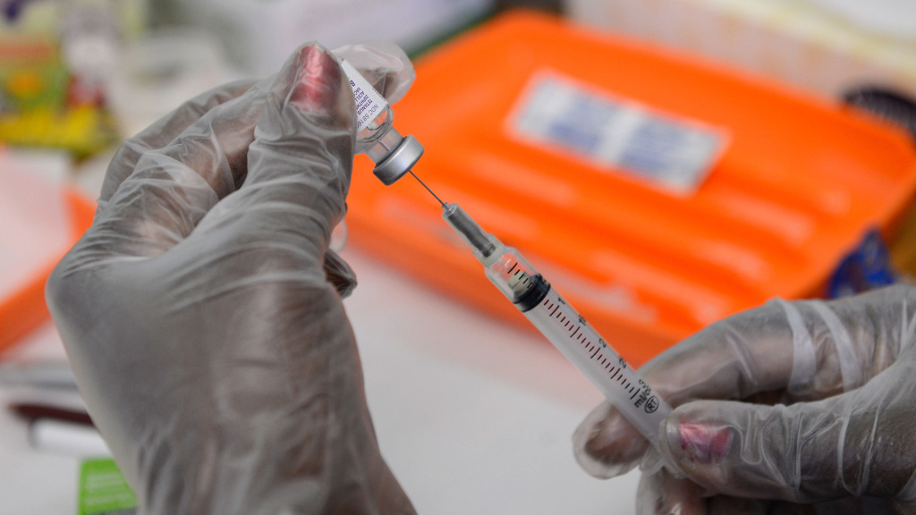 A school nurse prepares a vaccine against whooping cough before giving it to students at Mark Twain Middle School in Los Angeles. A school nurse prepares a vaccine against whooping cough before giving it to students at Mark Twain Middle School in Los Angeles.