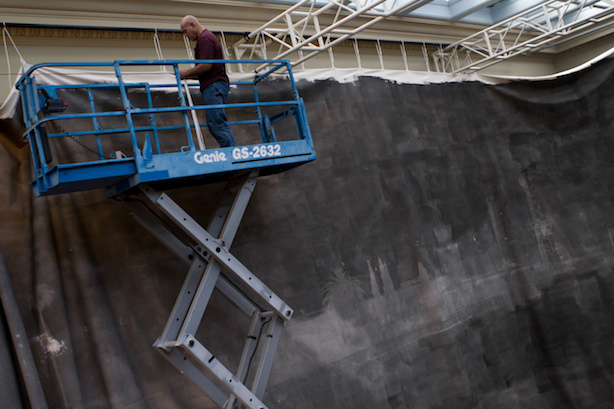 Mercer 19845 Tony Long hangs The Great Picture from the ceiling of the Culver Arts Center in Riverside, Calif. The installation took three days.