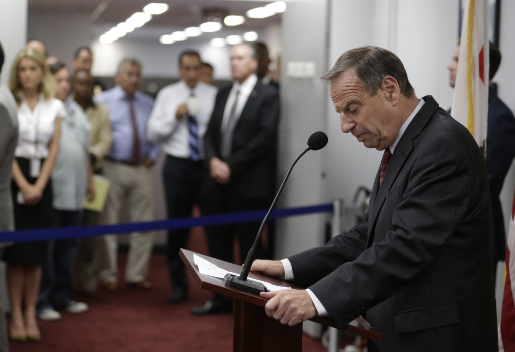 San Diego Mayor San Diego Mayor Bob Filner looks down at the podium as he speaks during a news conference at city hall, while a group of city workers look on, Friday, July 26, 2013, in San Diego. Filner said Friday he will undergo therapy after less than a year in office amid allegations that he sexually harassed women. Filner announced his plan for a two-week stay beginning Aug. 5. in a behavioral clinic after a series of women claimed he kissed, groped and placed them in headlocks.