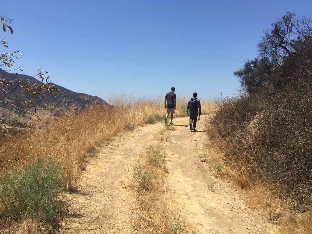 Miguel Ordeñana and A Martinez hike Miguel Ordeñana and A Martinez hike up to a wildlife camera in Griffith Park.