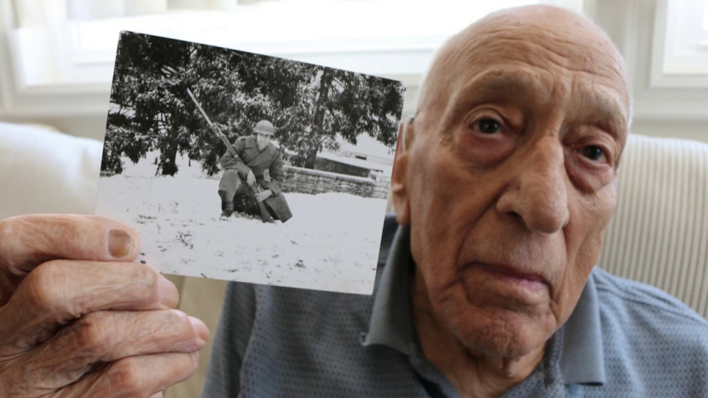 Steve Politis holds a picture of himself from World War Two. Politis was the only man of his 14 man unit to survive the Allied invasion of Sicily. Steve Politis holds a picture of himself from World War Two. Politis was the only man of his 14 man unit to survive the Allied invasion of Sicily.
