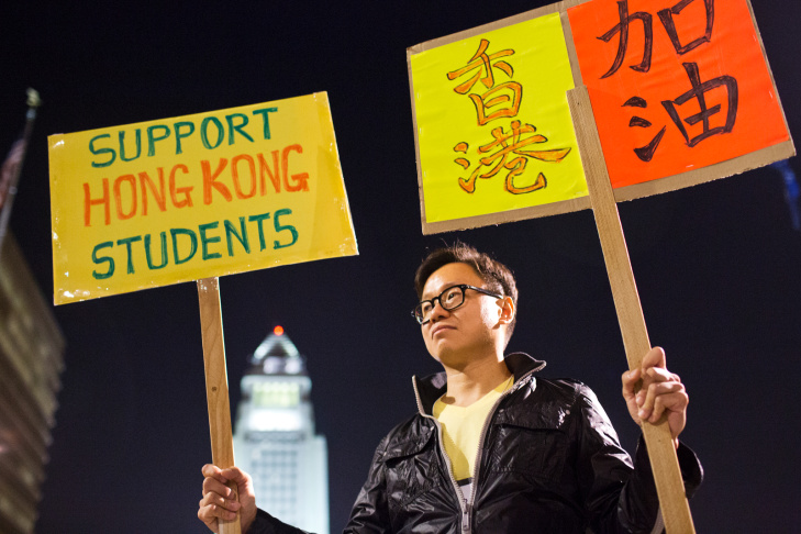 Hong Kong Forum Los Angeles organizer Donald Choy takes part during a vigil on Wednesday night, Oct. 1 at Grand Park in support of pro-democracy demonstrations happening in Hong Kong.