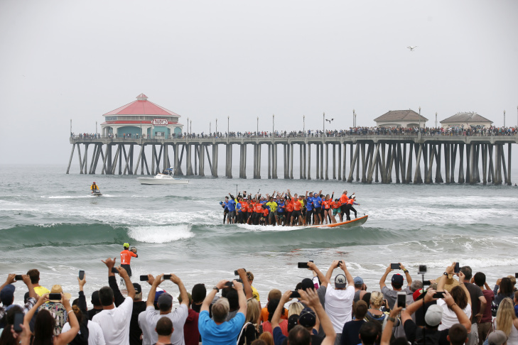 Surf City Usa Guinness World Records Surfing Le Broken In Sixty Six Surfers From Around The World Ride A Custom Built 42 Foot