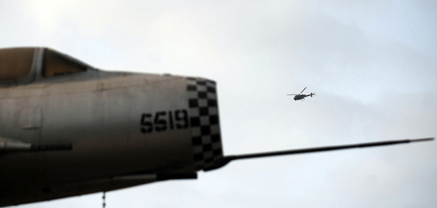 A Pakistani navy helicopter flies over a major naval air base following an attack by militants in Karachi on May 23, 2011. Taliban gunmen armed with rockets and explosives stormed a major naval air base in the heart of Pakistan's biggest city, destroying two US-made surveillance aircraft and killing 12 personnel. It was the worst assault on a military base since the army headquarters was besieged in October 2009, piling further embarrassment on the armed forces three weeks after US troops killed Osama bin Laden under their noses.