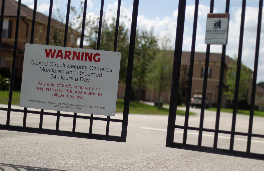 Trayvon Martin Shooting Brings Florida's Gated Communities Under Spotlight A security gate stands in front of The Retreat at Twin Lakes gated community where Trayvon Martin was shot and killed by George Michael Zimmerman while on neighborhood watch patrol on March 28, 2012 in Sanford, Florida.