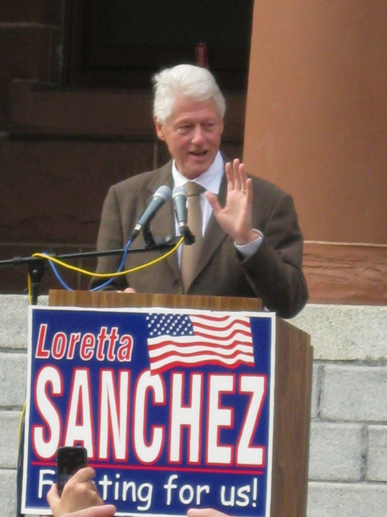 Former President Bill Clinton speaks at a campaign rally for Democratic Congresswoman Loretta Sanchez outside the Old Orange County Courthouse in Santa Ana this afternoon.