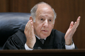 California Supreme Court Chief Justice Ronald M. George gestures as he speaks during a session at the California Supreme court March 4, 2008 in San Francisco, California.