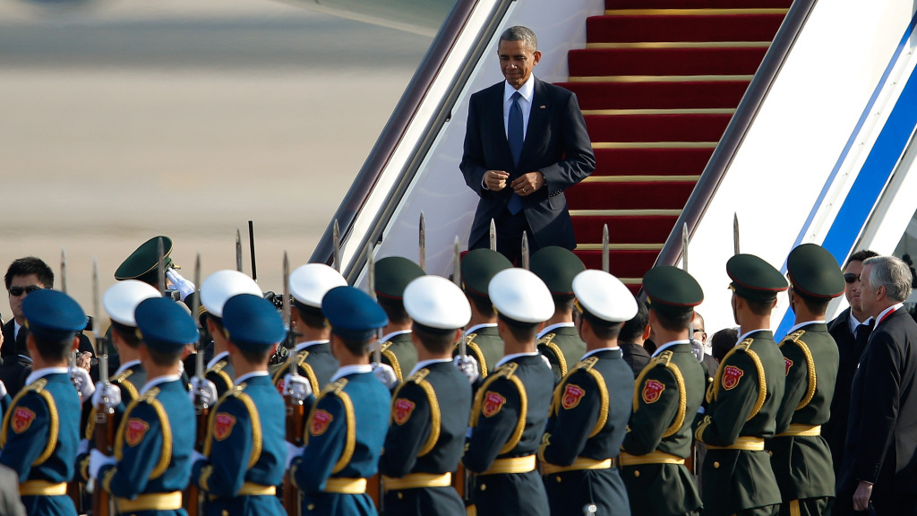 President Obama arrives at the Beijing airport Monday. Speaking at the APEC summit, the president unveiled a new deal to ease visa restrictions between the U.S. and China. President Obama arrives at the Beijing airport Monday. Speaking at the APEC summit, the president unveiled a new deal to ease visa restrictions between the U.S. and China.