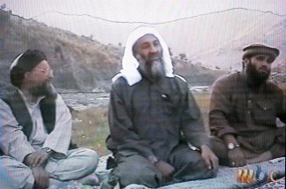This frame grab from the Saudi-owned television network MBC (Middle East Broadcasting Center) shows alleged terror mastermind Osama bin Laden sitting between his Egyptian lieutenant Ayman al-Zawahri (L) and Suleiman Abu Ghaith, the spokesman of his al-Qaeda network, in an undated videotape broadcast by the Dubai-based MBC April 17, 2002.
