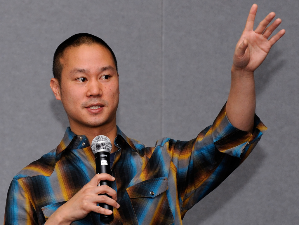 Zappos.com CEO Tony Hsieh delivers a keynote presentation at the MAGIC clothing industry convention in the Las Vegas. Don't worry about the tax breaks, he suggests to the states, because companies may have already made up their minds about where they want to be.