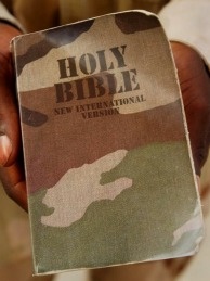 camouflage bible U.S. Army Sgt. Towolawi Sikiru displays his Bible, complete with a camouflage cover, after a Sunday evening Christian church in Baghdad, Iraq.