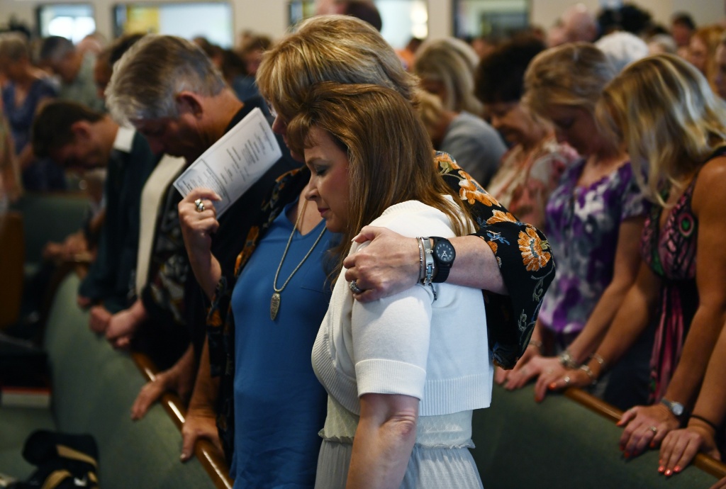 US-CRIME-TEXAS-SCHOOL-SHOOTING Worshippers attend a May 20, 2018 mass at Arcadia First Baptist Church in memory of the Santa Fe High School shooting victims, in Santa Fe, Texas.